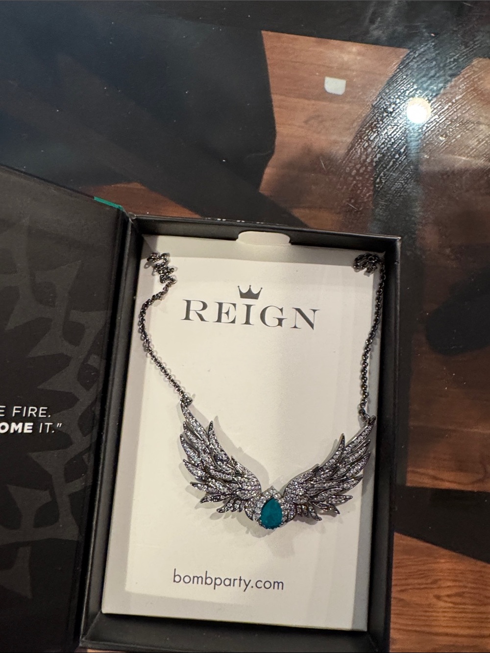 REIGN Silver Wing Necklace with Teal Teardrop Stone